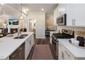 Open concept kitchen with stainless steel appliances and island at 204 Shingle Oak Rd, Wake Forest, NC 27587