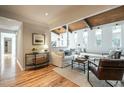 Open concept living space featuring hardwood floors, a comfy seating area, and lots of natural light at 4824 Sandberry Ln, Raleigh, NC 27613