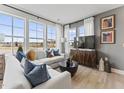 Spacious living room showcasing a large window and comfy sofa at 10537 Pleasant Branch Dr # 101, Raleigh, NC 27614