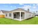 Covered patio off of the back of the house, overlooking the backyard at 2508 Trevana Way, Graham, NC 27253