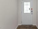 Front entry with white door and glass accents at 2508 Trevana Way, Graham, NC 27253