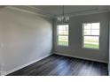 Formal dining area with hardwood floors and large windows at 3713 Watson Ridge Ln # Tessa, Raleigh, NC 27616