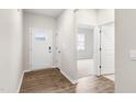 Bright and airy entryway with wood-look flooring and access to other rooms at 425 Ashley Run, Sanford, NC 27330