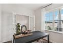 Spacious home office with a window and an open doorway at 6433 Alfalfa Ln, Wake Forest, NC 27587