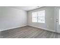 Bright office space featuring gray vinyl plank flooring and window blinds at 103 Wilderness Ct, Mebane, NC 27302