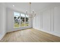 Spacious dining room with hardwood floors and large windows at 2637 Trifle Ln, Wake Forest, NC 27587