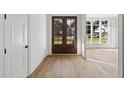 Bright and airy foyer with hardwood floors and double doors at 2637 Trifle Ln, Wake Forest, NC 27587