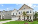 Two-story house with stone accents and a front porch at 276 Umstead St, Sanford, NC 27330