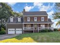 Two-story house with a two-car garage and a spacious yard at 6300 Calico Ct, Wake Forest, NC 27587