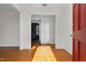 Bright entryway with hardwood floors and view into the living room at 1204 Breedlove Rd, Nashville, NC 27856