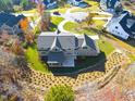 House nestled in a community with mature trees and winding roads at 154 Leatherwood Ln, Chapel Hill, NC 27517