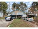 Brick house with carport and balcony, offering curb appeal at 511 Elmira Ave, Durham, NC 27707