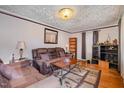 Living room features hardwood floors, a cozy seating area, and decorative accents at 511 Elmira Ave, Durham, NC 27707