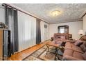 Living room with hardwood floors and ample natural light at 511 Elmira Ave, Durham, NC 27707