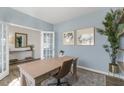 Spacious home office with light walls, French doors, and ample natural light at 2010 Fletchers Ridge Dr, Durham, NC 27703