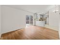 View of dining area and kitchen with access to deck at 108 N Woodshed Ct, Cary, NC 27513