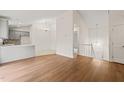 Open concept dining area with hardwood floors and kitchen access at 108 N Woodshed Ct, Cary, NC 27513