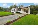 Updated ranch home with a large yard and long driveway at 2112 Eastwood Dr, Durham, NC 27703