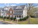 Two-story townhome with brick and siding exterior, nestled in a quiet neighborhood at 2659 Garden Knoll Ln, Raleigh, NC 27614