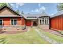 Stone and red siding home with walkway leading to the front entrance at 3240 Hillcastle Trl, Chapel Hill, NC 27516