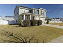 Two story house with gray siding, white garage door, and landscaping at 3341 Sandy Meadow Dr Dr, Fuquay Varina, NC 27526