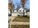 Two-story house with white siding, blue shutters, and a two-car garage at 1008 Willow Ridge Dr, Knightdale, NC 27545