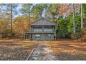 Two-story lakefront home with a walkway and balconies at 148 Silver Lake Pt Pt, Sanford, NC 27332
