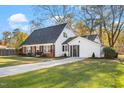 Updated brick and white ranch home with a large yard and long driveway at 203 Hillside Dr, Smithfield, NC 27577