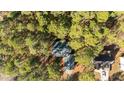High-angle view of the house amongst a wooded area at 3064 Carolina Way, Sanford, NC 27332