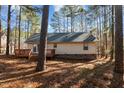 House back view, deck, and wooded area at 3064 Carolina Way, Sanford, NC 27332