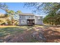 Two story gray house with deck and large backyard at 3128 Gold Dust Ln, Willow Springs, NC 27592