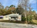 One-story house with a yard and trees at 5324 Rock Quarry Rd, Raleigh, NC 27610