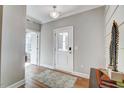 Bright entryway with wood floors and neutral walls at 9516 Woodriver Dr, Zebulon, NC 27597