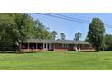 Ranch house with large yard and mature trees at 5813 Cheek Rd, Durham, NC 27704