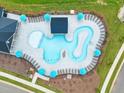 Community pool with lounge chairs and umbrellas at 716 Georgia'S Landing Pkwy # 12, Raleigh, NC 27603