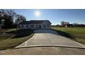 New home with a large concrete driveway at 198 Pate Landing Dr, Selma, NC 27576