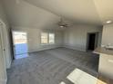 Open living room with hardwood floors and access to the front porch at 198 Pate Landing Dr, Selma, NC 27576
