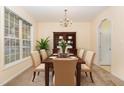 Formal dining room featuring a wooden table, six chairs, and a large hutch at 2124 Star Sapphire Dr, Raleigh, NC 27610