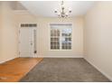 Bright living room with hardwood and carpeted floors, and a view to the front door at 2124 Star Sapphire Dr, Raleigh, NC 27610