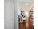 Open living area with hardwood floors and access to kitchen at 407 Eagle Ct, Henderson, NC 27536