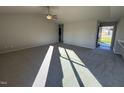 Spacious living room with gray carpet and lots of natural light at 186 Pate Landing Dr, Selma, NC 27576