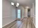 Bright dining room with hardwood floors and chandelier at 1112 Minnie Dr, Raleigh, NC 27603