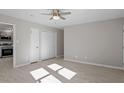 Well-lit bedroom with double door closet and ceiling fan at 1205 Pecan Pl, Durham, NC 27704