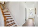 Staircase with wooden handrail and carpeted steps at 1412 Matisse Dr, Fuquay Varina, NC 27526