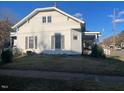 White siding home with a side porch and nicely landscaped yard at 201 N Massey St, Selma, NC 27576