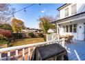 Spacious deck with seating area overlooking a grassy backyard at 220 S Fayetteville St, Clayton, NC 27520