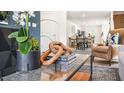 Stylish living room showcasing a coffee table with decor, view to kitchen at 8656 Brixton Shay Dr, Raleigh, NC 27616