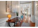 Bright entryway with hardwood floors and elegant wall art at 920 Chapanoke Rd, Raleigh, NC 27603