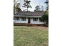 House exterior with a large yard and inviting front porch at 6232 Dawn Dr, Hurdle Mills, NC 27541