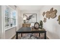 Bright home office features a large window, built-in shelving, and workspace at 6440 Alfalfa Ln, Wake Forest, NC 27587